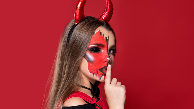 Woman in devil costume 