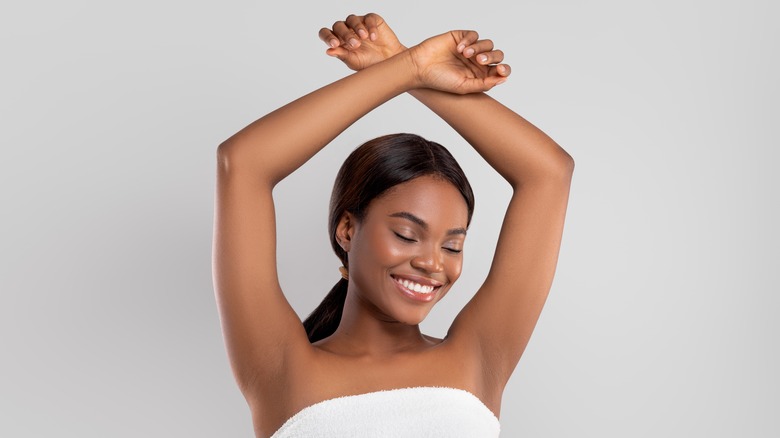Woman showing armpits 