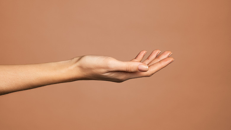 Woman's hand reaching out