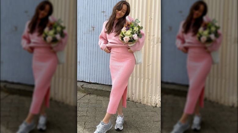 woman in matching pink sweater set