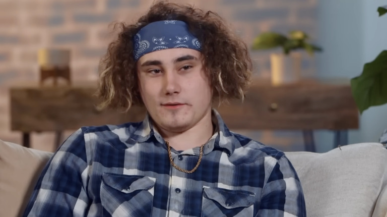 Jason Korpi in flannel and headband on "Unexpected"