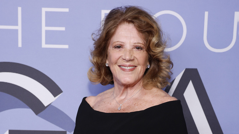 Linda Lavin on the red carpet, smiling at the camera in a black dress