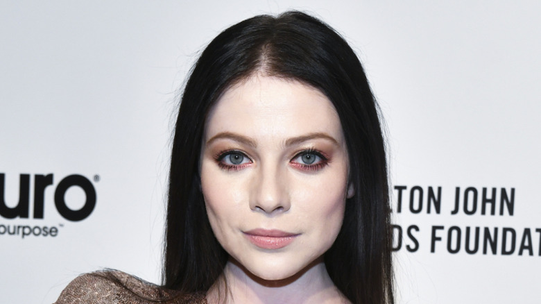 Michelle Trachtenberg posing for the cameras at a red carpet event