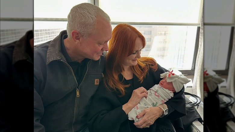 Ree and Ladd Drummond holding their granddaughter