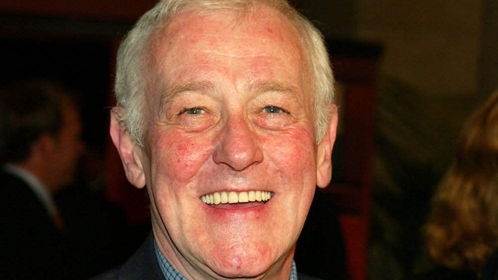 John Mahoney smiling at a red carpet event