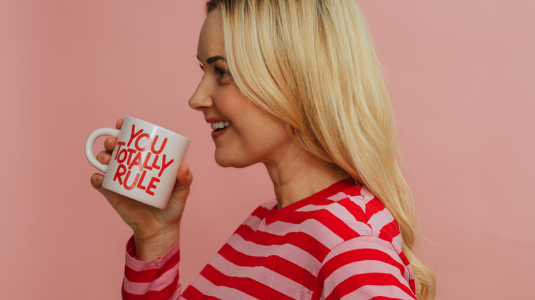 Woman smiling with mug