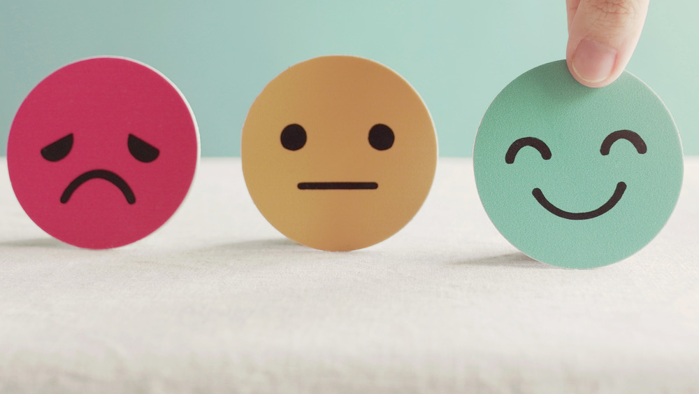 Three faces on the pain scale, concept