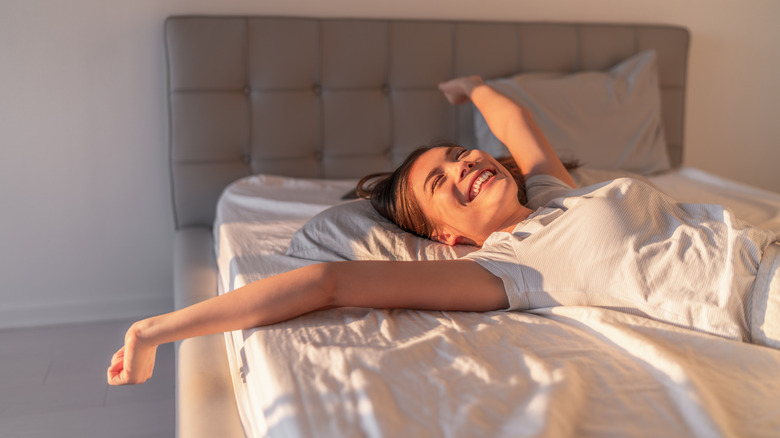 woman waking up happy 