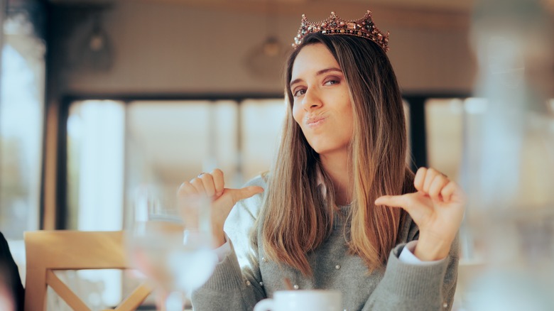 Smug woman with crown 