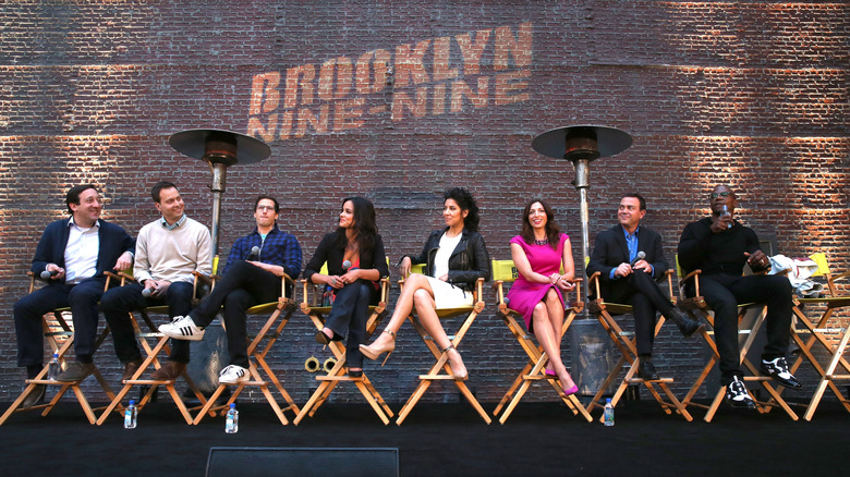 Stephanie Beatriz with the cast of Brooklyn Nine-Nine