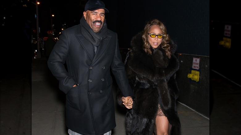 Steve Harvey and Marjorie Harvey walking