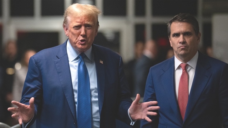 Donald Trump and Todd Blanche outside court