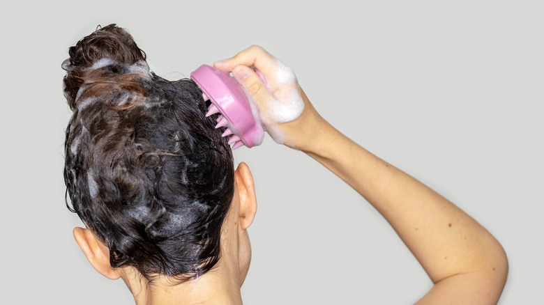 Woman shampooing her hair