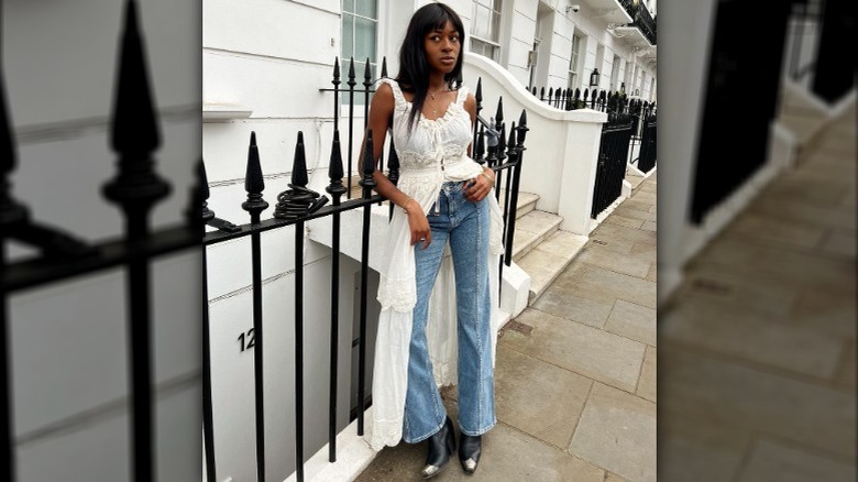 fashionable woman posing in jeans