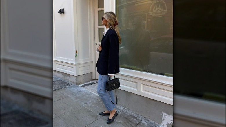 fashionable woman holding a Chanel bag