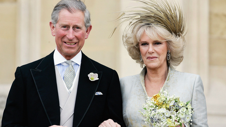 King Charles III and Camilla Queen Consort smiling on their wedding day