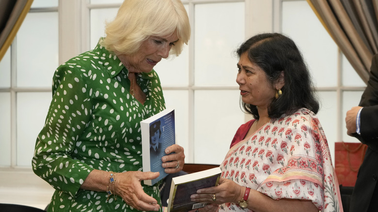 Camilla, Queen Consort, holding a book 