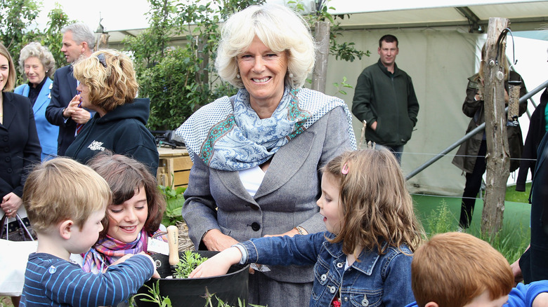 Camilla, Queen Consort smiling with kids
