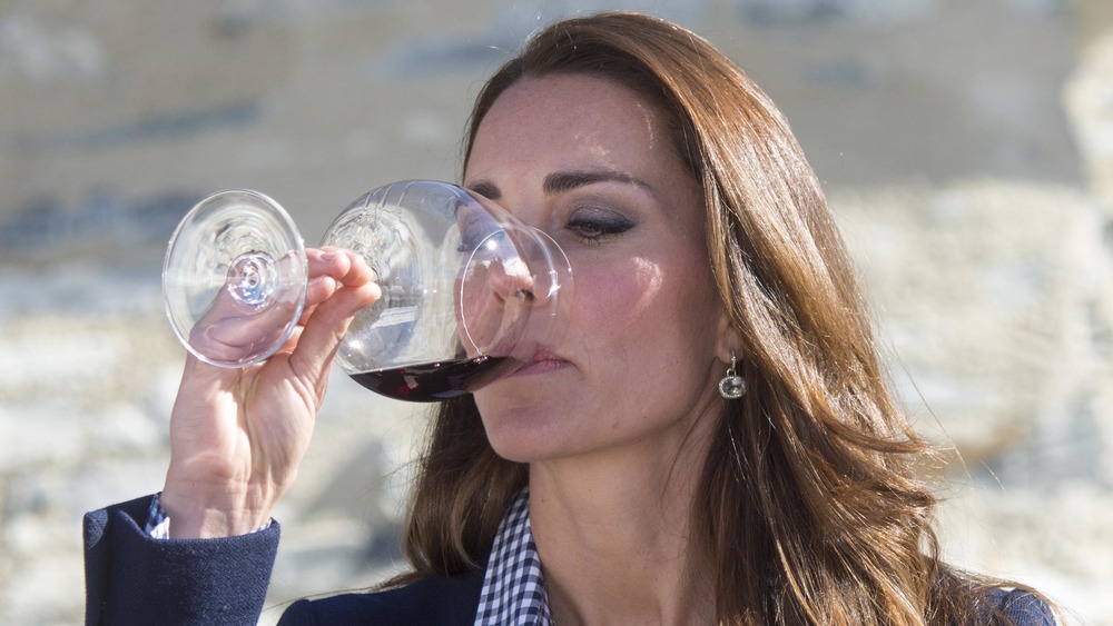 Kate Middleton drinking a glass of red wine