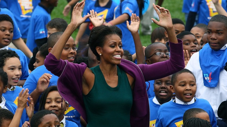 Michelle Obama doing jumping jacks