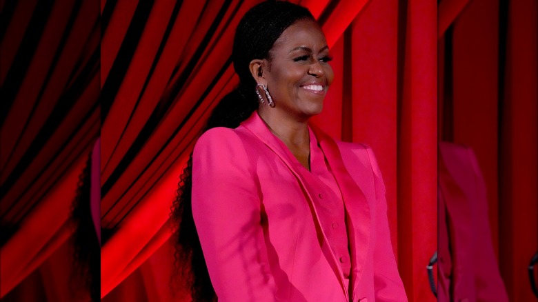 Michelle Obama smiling on stage