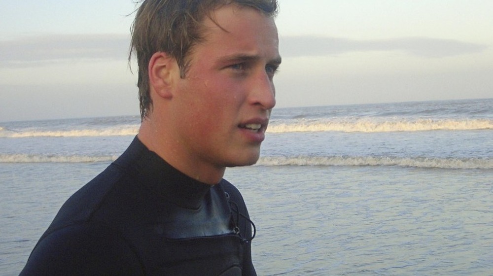 Prince William in a wetsuit at the beach