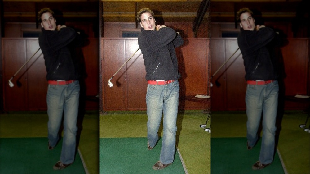 Prince William as a young man with a golf club