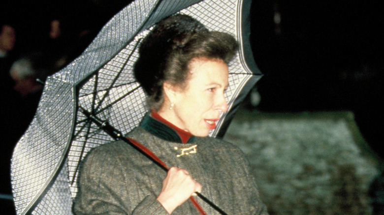 Princess Anne holding umbrella, 1990 