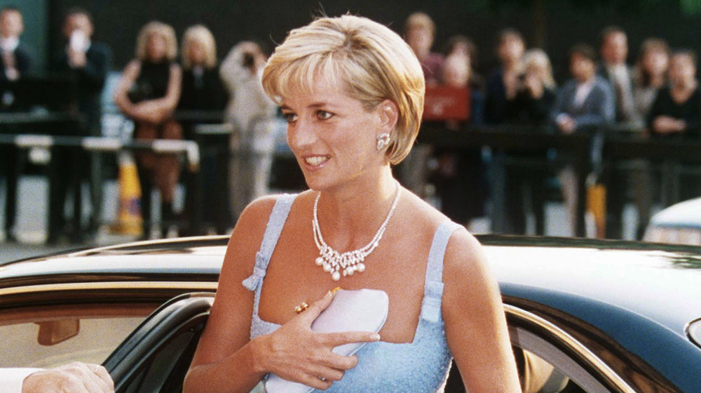 Princess Diana exiting a vehicle