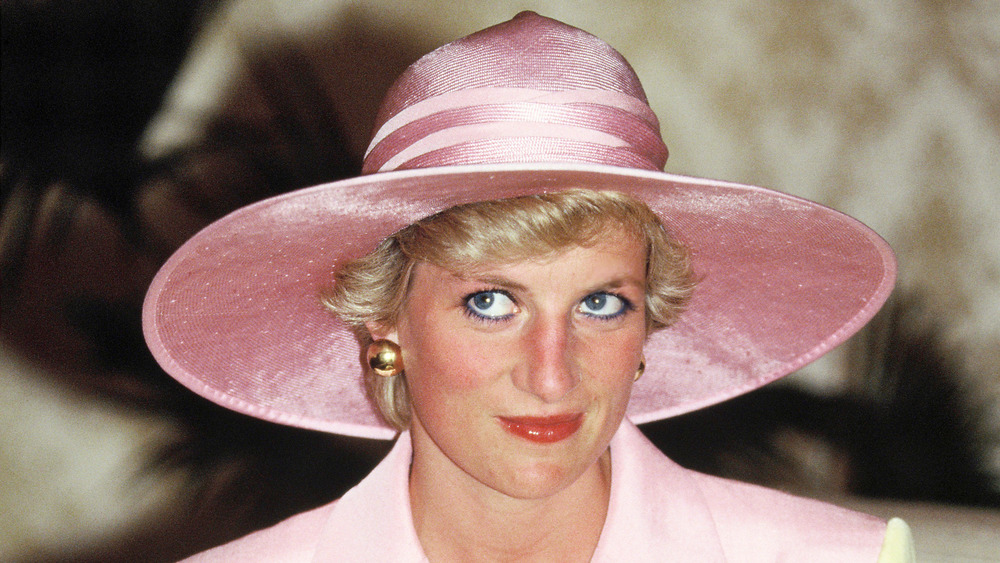 Princess Diana wearing a pink hat