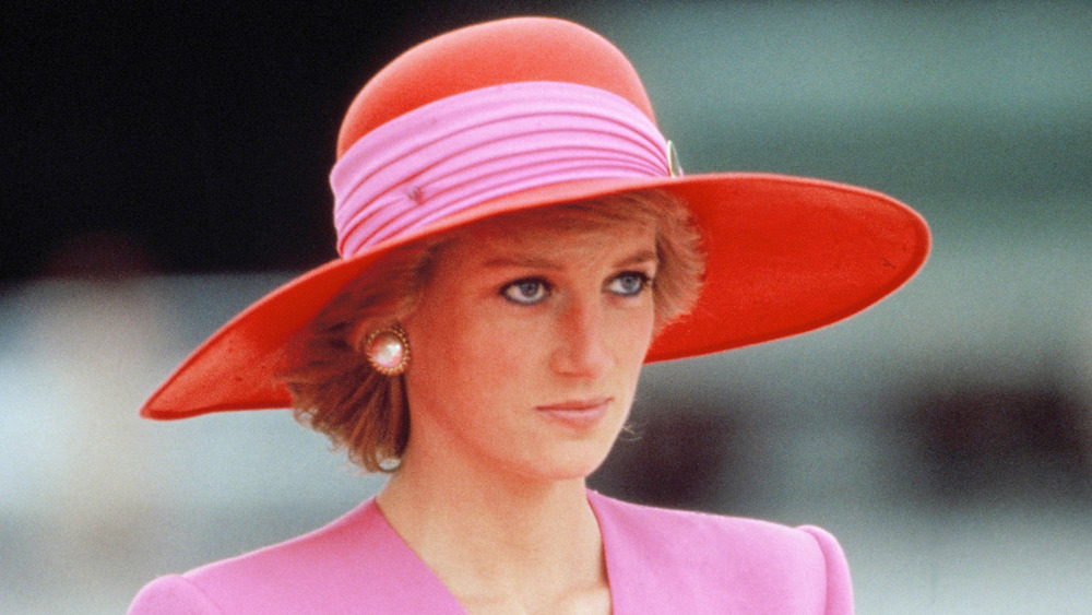 Princess Diana wearing a red hat in 1989