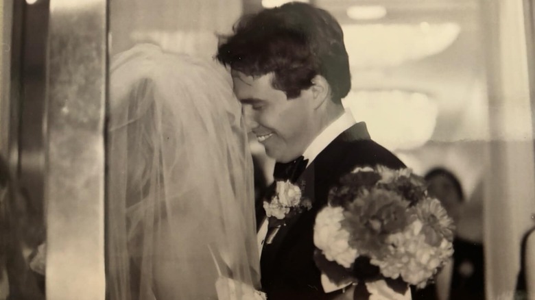 Black and white photo of Alisyn Camerota and her husband Tim Lewis on their wedding day.