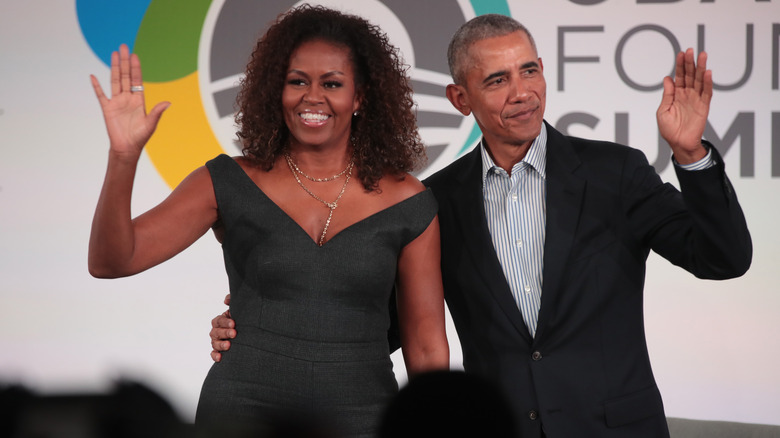 Michelle Obama and Barack Obama waving