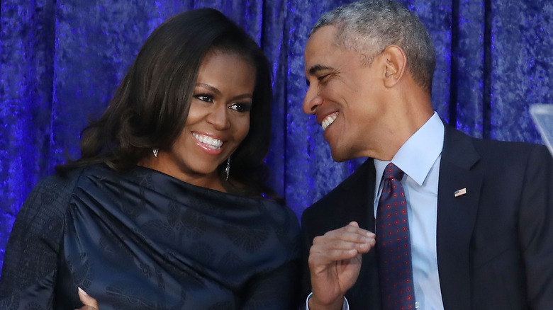 Michelle Obama and Barack Obama smiling