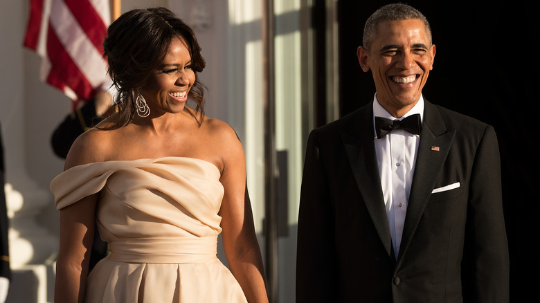 Michelle Obama and Barack Obama laughing together