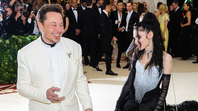 Elon Musk and Grimes smiling together