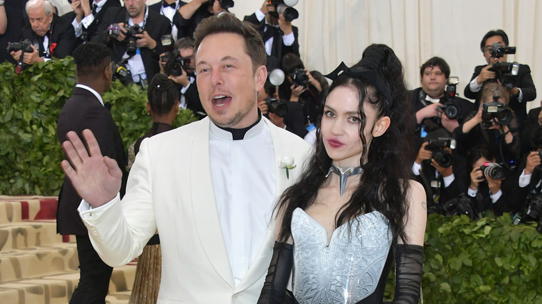 Elon Musk and Grimes at an event