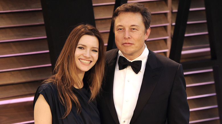 Elon Musk and Talulah Riley posing for photos