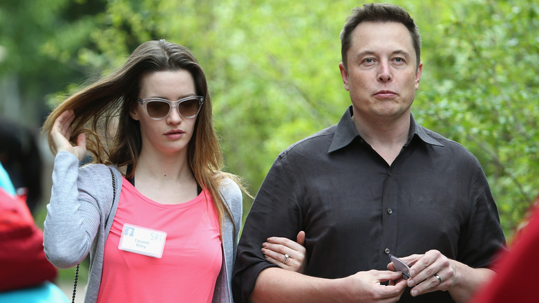 Elon Musk and Talulah Riley walking