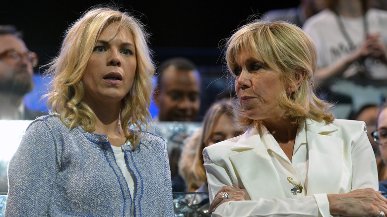 Brigitte Macron and her daughter Laurence Auziere-Jourdan speaking