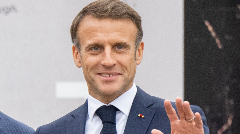 Emmanuel Macron waving and smiling