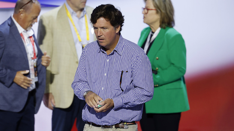 Tucker Carlson walks around at the 2024 Republican National Convention