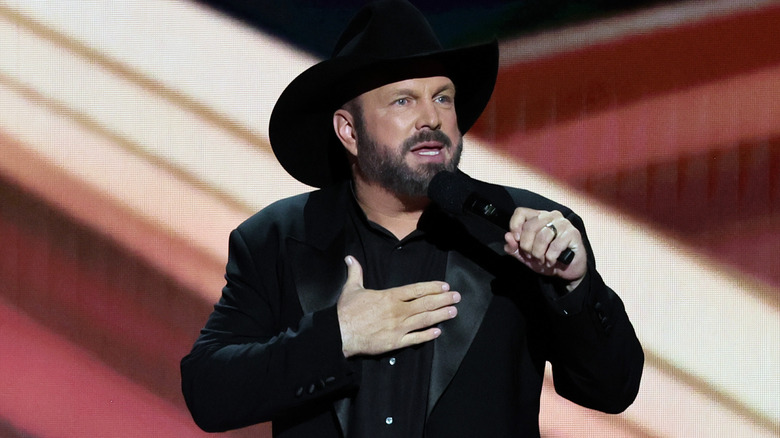 Garth Brooks speaking to an audience from the stage