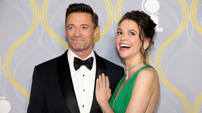 Hugh Jackman smiling with Sutton Foster