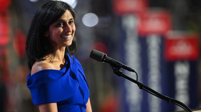 Usha Vance blue dress at microphone