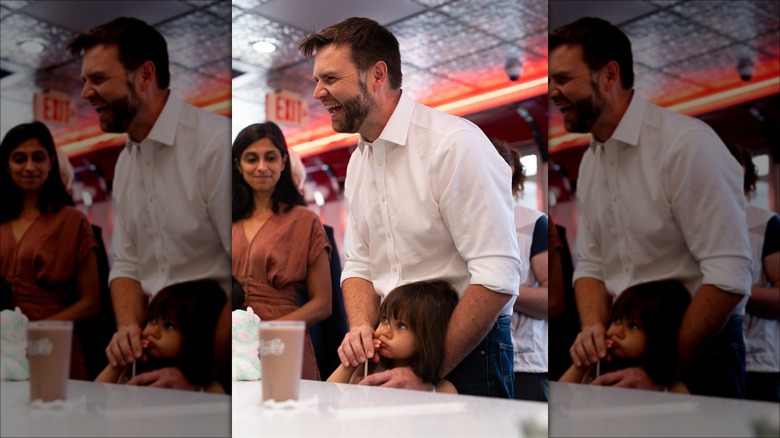 Usha Vance, JD Vance, and their daughter at a restaurant