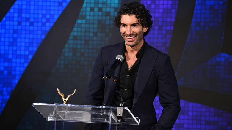 Justin Baldoni delivering a speech