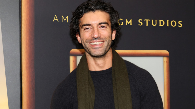 Justin Baldoni beaming at the camera