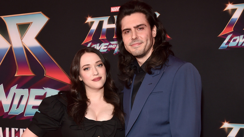 Kat Dennings and Andrew W.K. posing together on red carpet