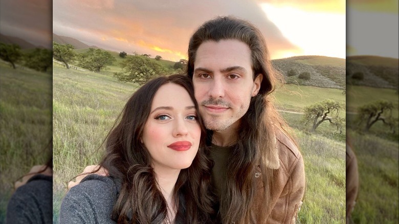 Kat Dennings and Andrew W.K. smiling taking selfie outside